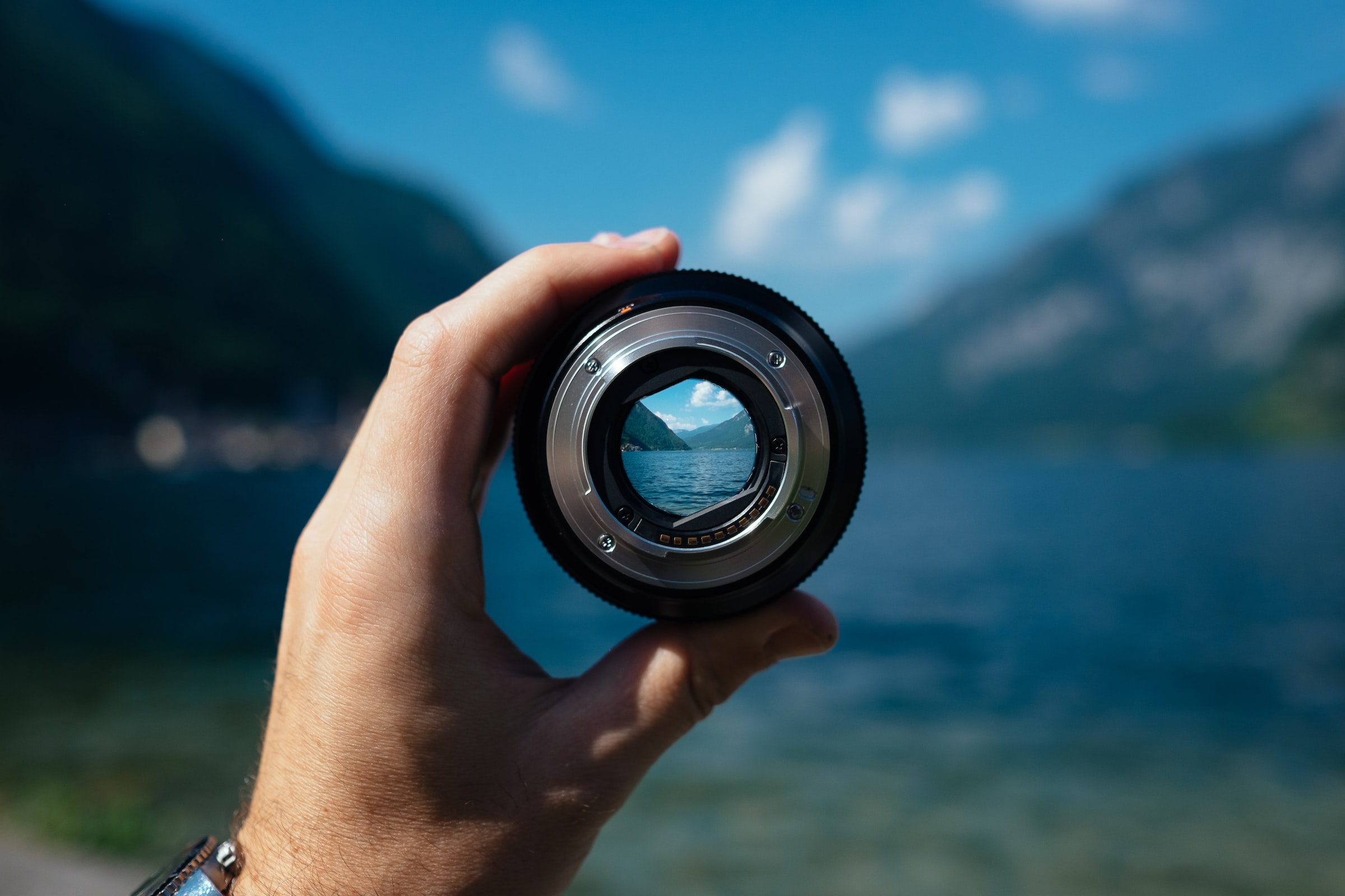 A picture of a lens focusing on a scene in the mountains.